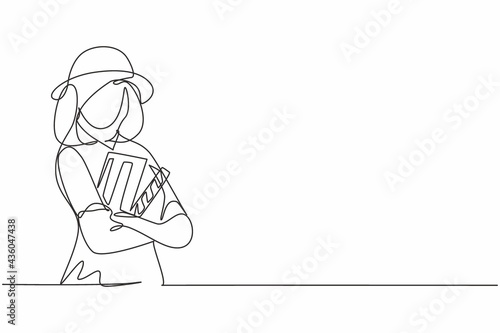 Single continuous line drawing of young female film director cross arms holding clapper board. Professional work job occupation. Minimalism concept one line draw graphic design vector illustration