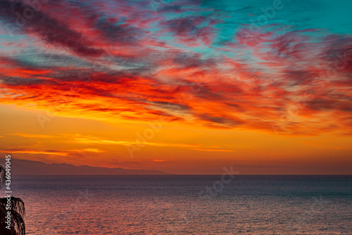 Fototapeta Naklejka Na Ścianę i Meble -  Fire sky over the ocean. Beautiful sunrise sky over the sea 