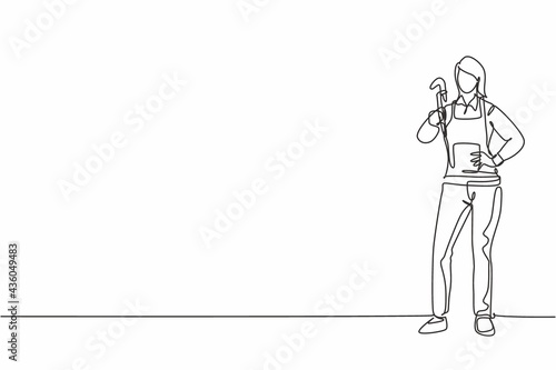Single one line drawing of young beauty female plumber posing with hands on hip. Professional work profession and occupation minimal concept. Continuous line draw design graphic vector illustration
