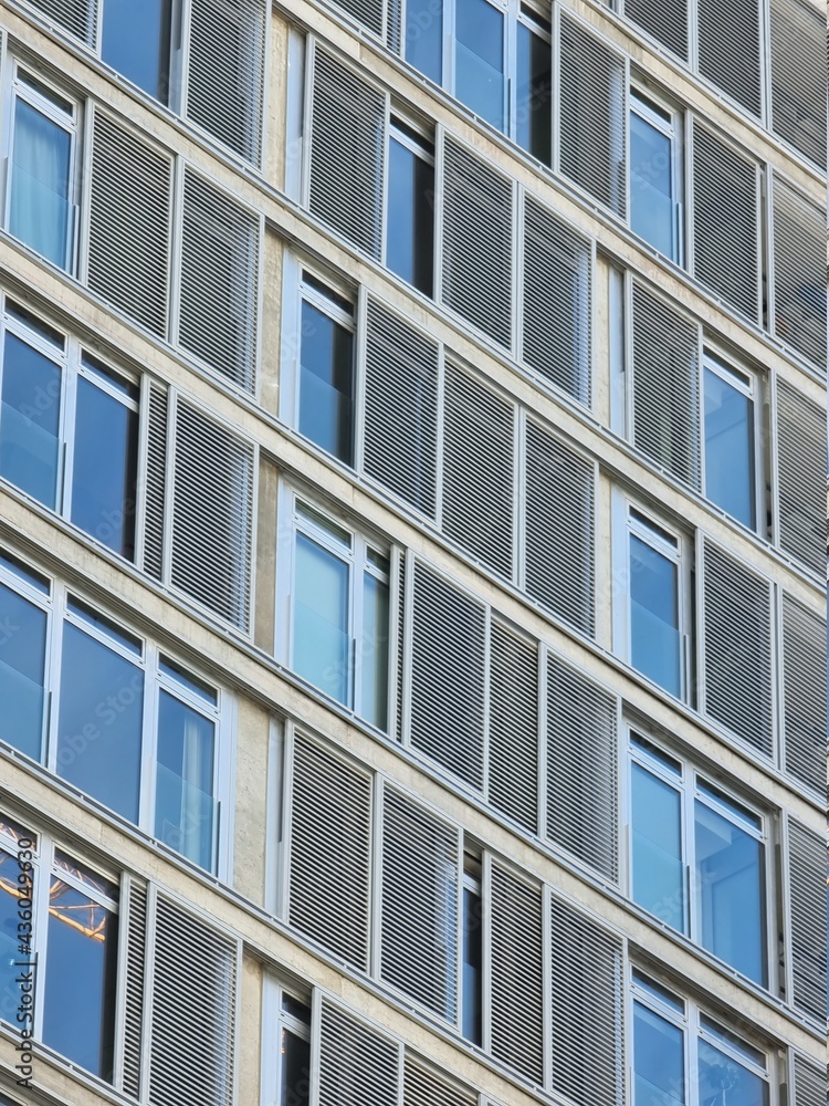 Modern building facade with windows and patterns Modern building facade with windows and patterns