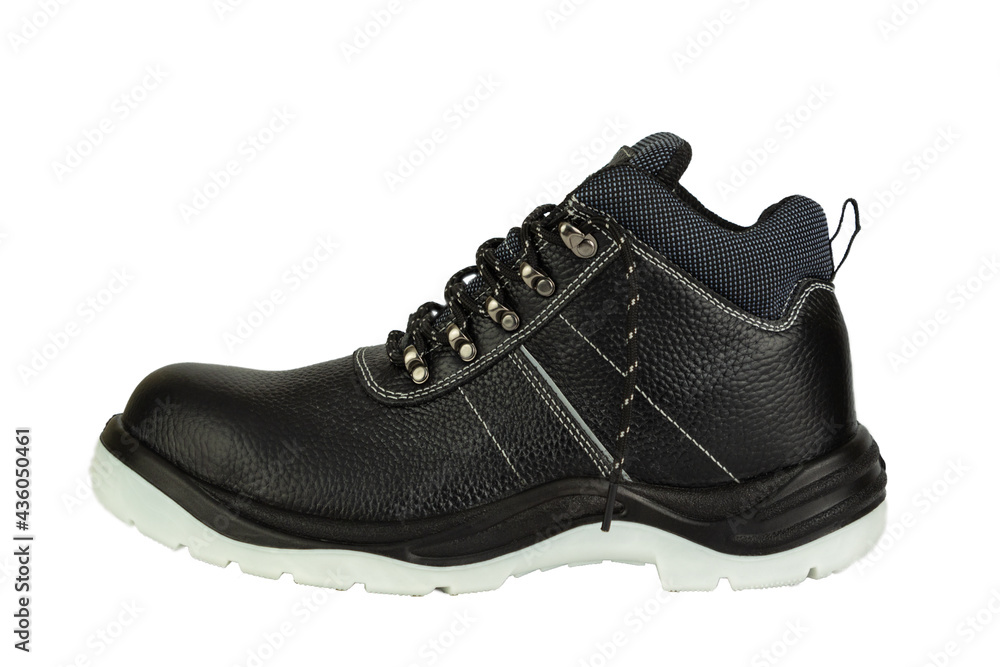 A working black leather boot with a thick gray sole on a white background. Side view.  The shoes are new and clean. The laces are untied. The image is isolated. The boot is in the center.