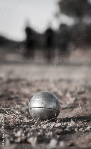 black and white Petanque bol on the ground
