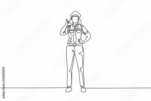 Single continuous line drawing woman pilot stands with a thumbs-up gesture and uniform serves airplane passengers fly to their destination. Dynamic one line draw graphic design vector illustration.