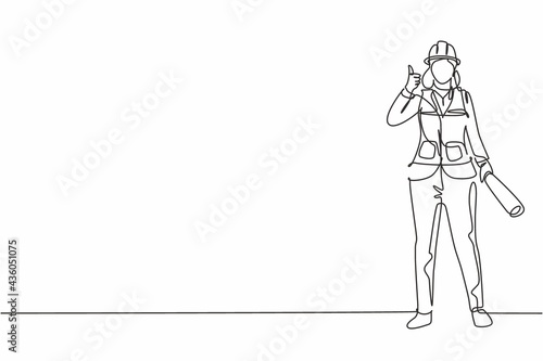 Continuous one line drawing the female architect stands with a thumbs-up gesture and wears a helmet with a blueprint for the building's work plan. Single line draw design vector graphic illustration.