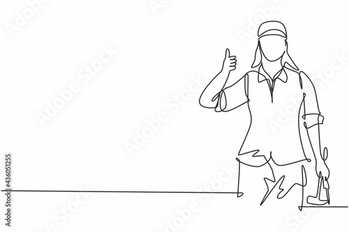 Single continuous line drawing carpenter woman with a thumbs-up gesture works in his workshop making wooden products. Skills in using carpentry tools. One line draw graphic design vector illustration