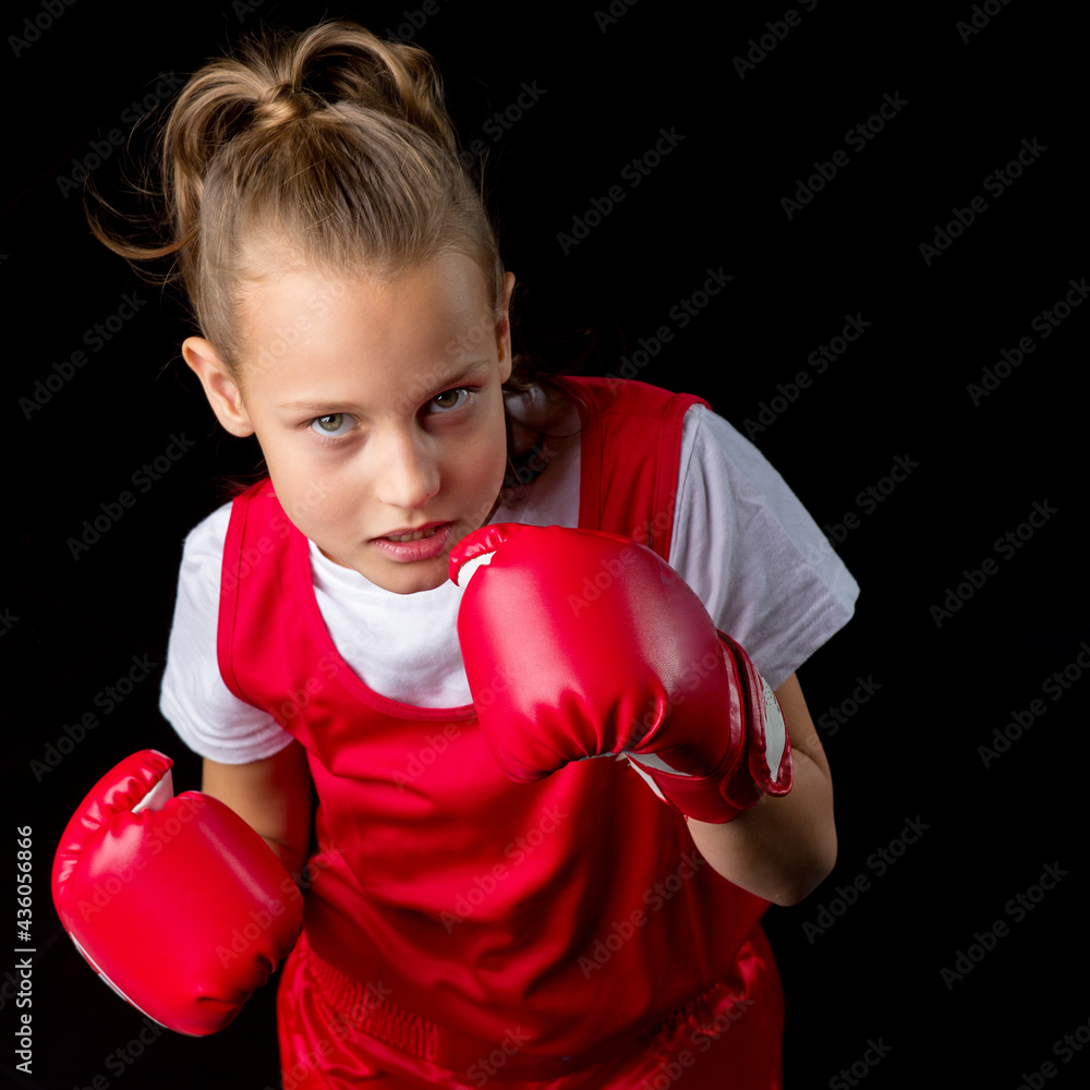 Sporty teenage girl doing boxing exercises Sporty teenage girl doing boxing exercises