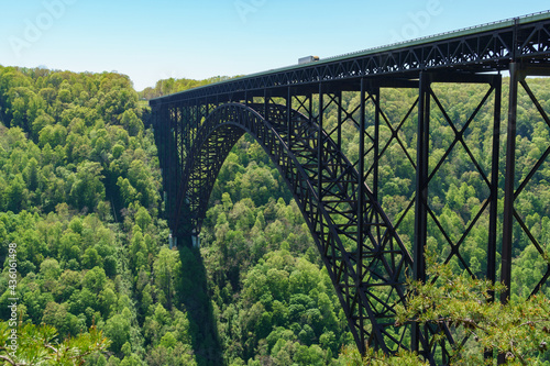 Truck passing over the New River Gorge Bridge shows perspective