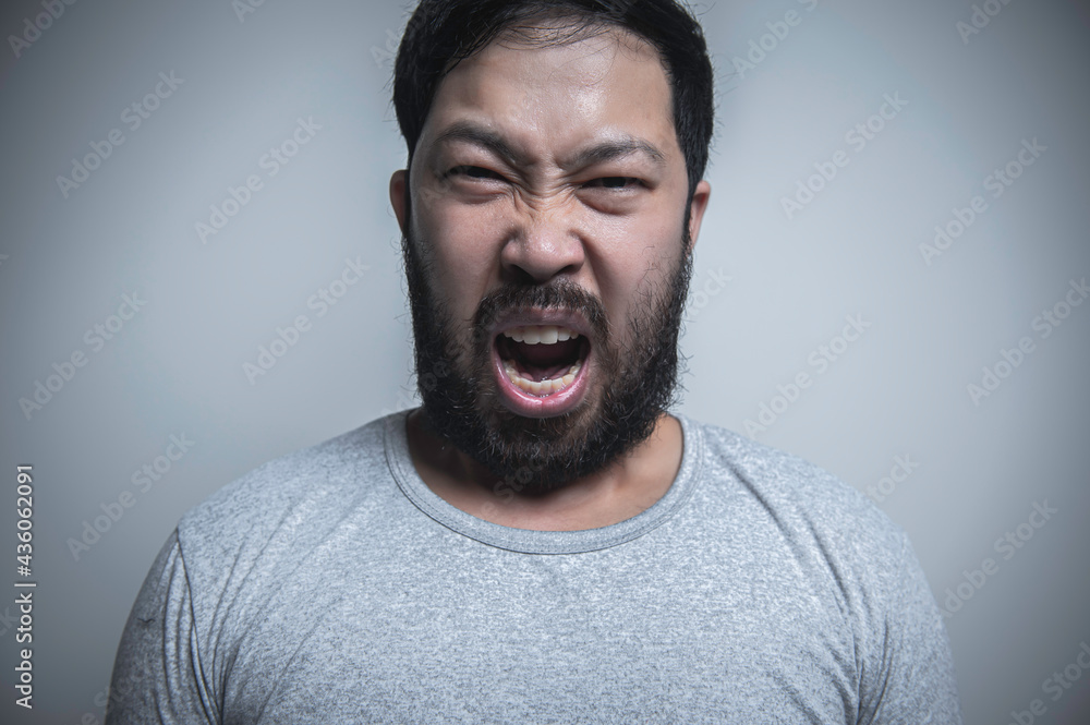 Asian handsome man angry on white background,Portrait of young Stress male concept Asian handsome man angry on white background,Portrait of young Stress male concept