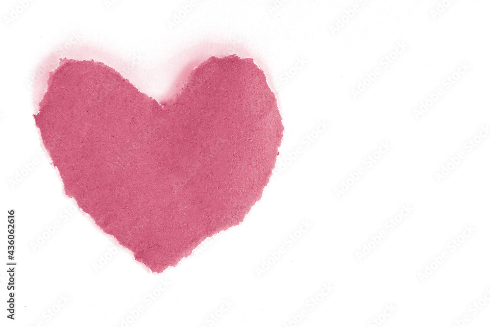 Ripped pink paper heart shaped isolated on white