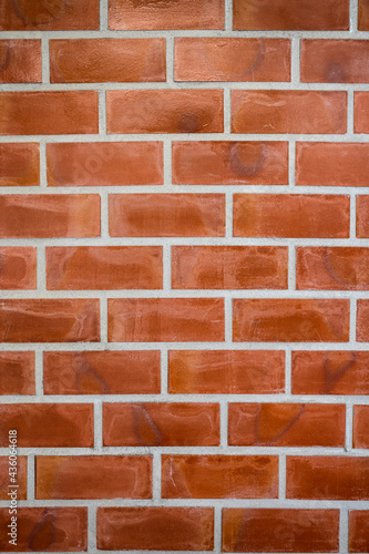 Orange bricks block on cement wall