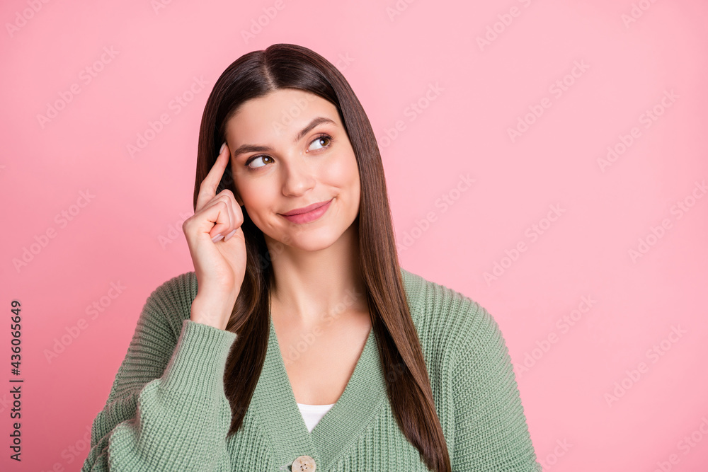 Photo of pretty optimistic girl look empty space finger head wear sweater isolated on pink color background Photo of pretty optimistic girl look empty space finger head wear sweater isolated on pink color background