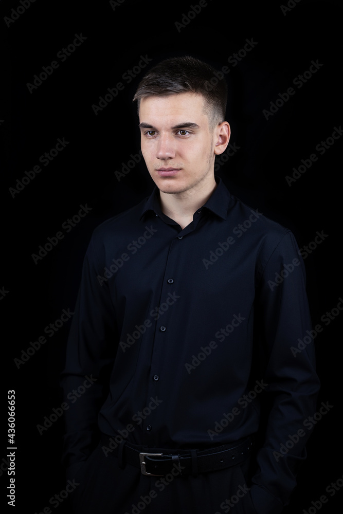 Obraz premium Male businessman on a black background