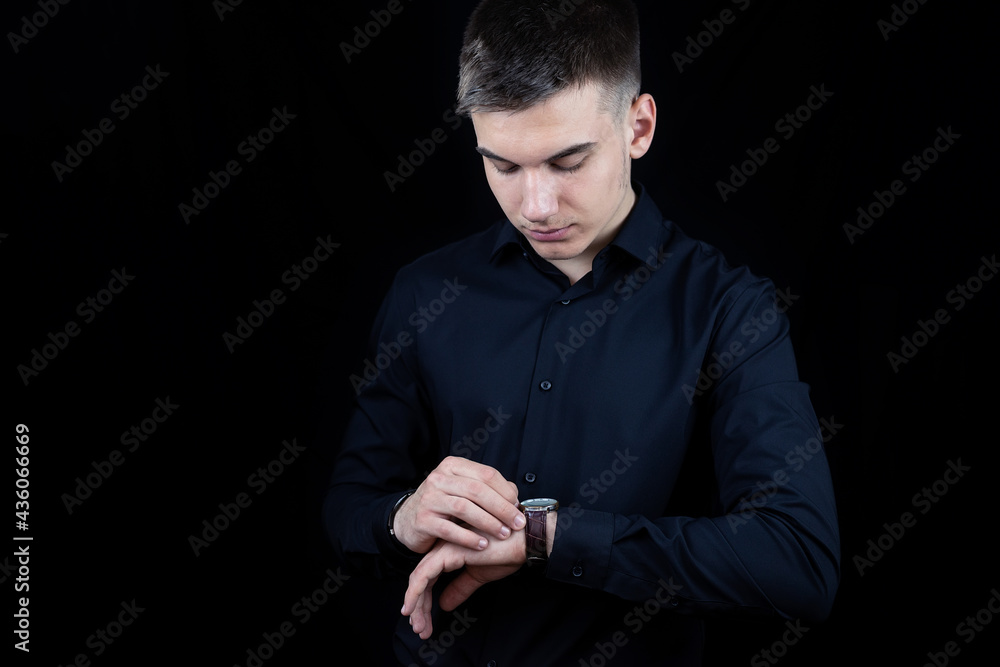Male businessman on a black background Male businessman on a black background
