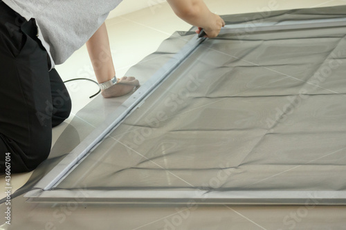 man install mosquito net wire screen on house window protection against insect