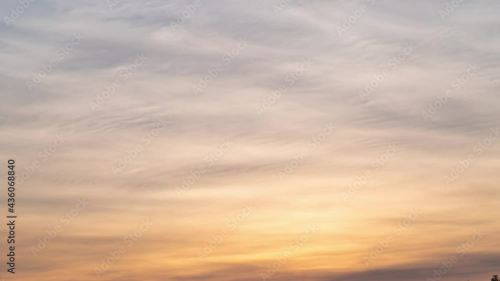 sunset orange sky. feather of silky transparent clouds in atmosphere. sunset orange sky. feather of silky transparent clouds in atmosphere.