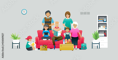 A large family has members sitting on a sofa against a gray background.