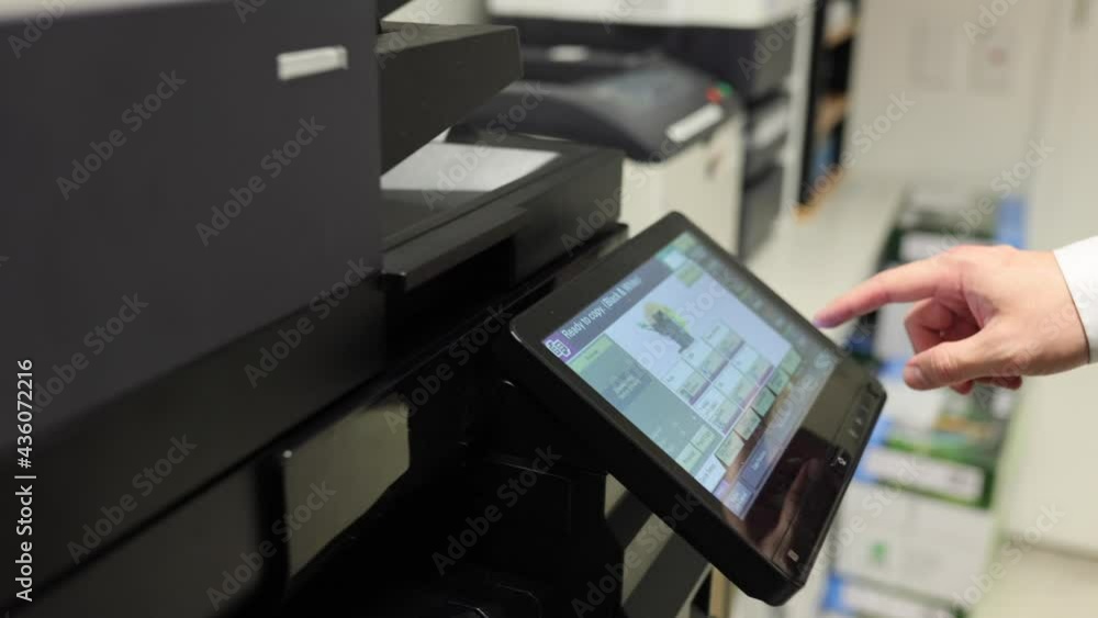Business Man In Office Using a Photo Copier Scanning Printing Upclose Camera of Hands and Buttons Business Man In Office Using a Photo Copier Scanning Printing Upclose Camera of Hands and Buttons