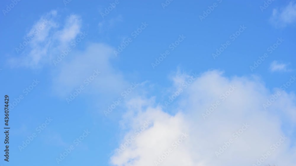 Beautiful cloudy summer sky timelapse. Large white clouds in the blue summer sky landscape. Beautiful cloudy summer sky timelapse. Large white clouds in the blue summer sky landscape.