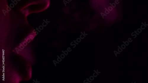 woman is blowing the smoke of hookah. detail , macro 4k slowmotion