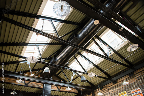 Obraz na płótnie Interior of industrial roof rafters with dramatic light and shadow