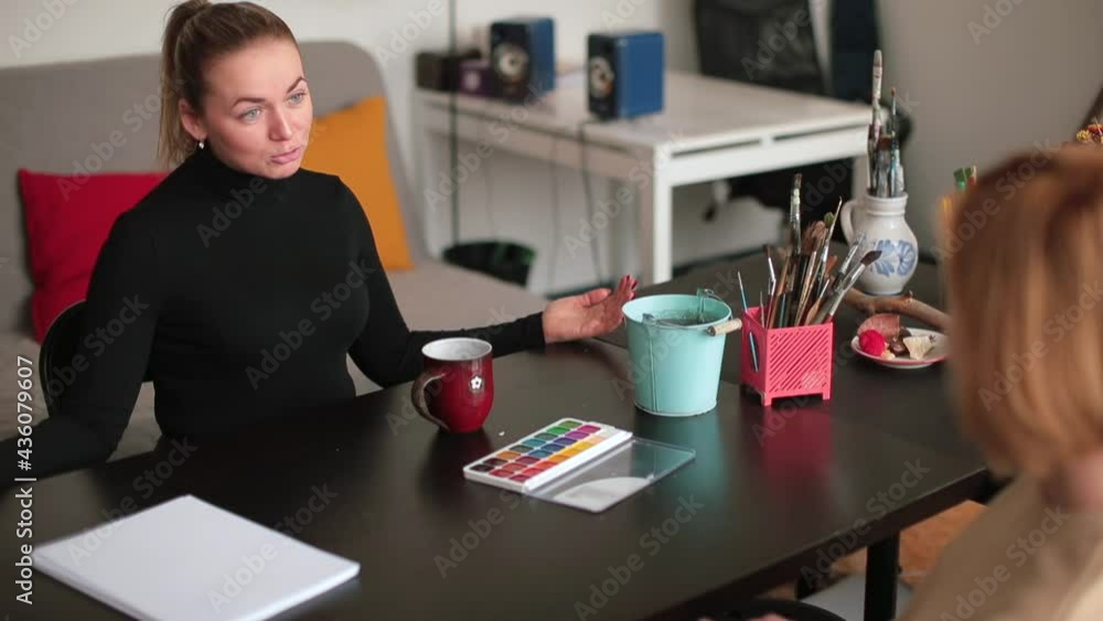 Meeting of the patient with the psychotherapist in the room. They talk about problematic topics. Paints on the table. readiness for therapy. Meeting of the patient with the psychotherapist in the room. They talk about problematic topics. Paints on the table. readiness for therapy.