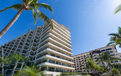 Luxury condominiums and apartments on Playa De Los Muertos beach and pier close to the famous Puerto Vallarta Malecon, the city largest public beach. © eskystudio