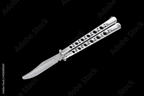 Silver butterfly knife balisong isolated on black background.