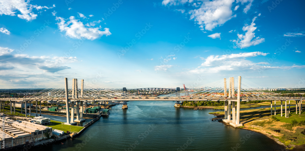 Fototapeta premium Aerial panorama of the New Goethals Bridge, spanning Arthur Kill strait between Elizabeth, New Jersey and Staten Island, New York. The New Goethals Bridge carries 6 lanes of I-278.
