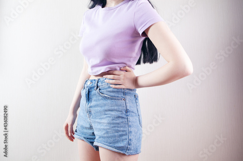 young woman posing in shorts