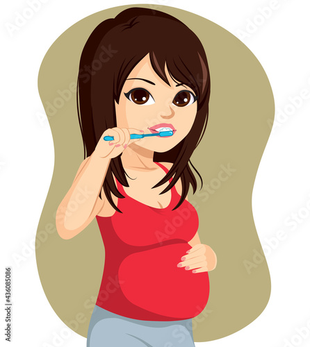 Pregnant woman brushing her teeth pregnancy hygiene concept