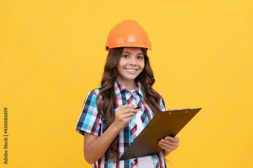happy teen girl in construction helmet making notes in clipboard, making notes happy teen girl in construction helmet making notes in clipboard, making notes