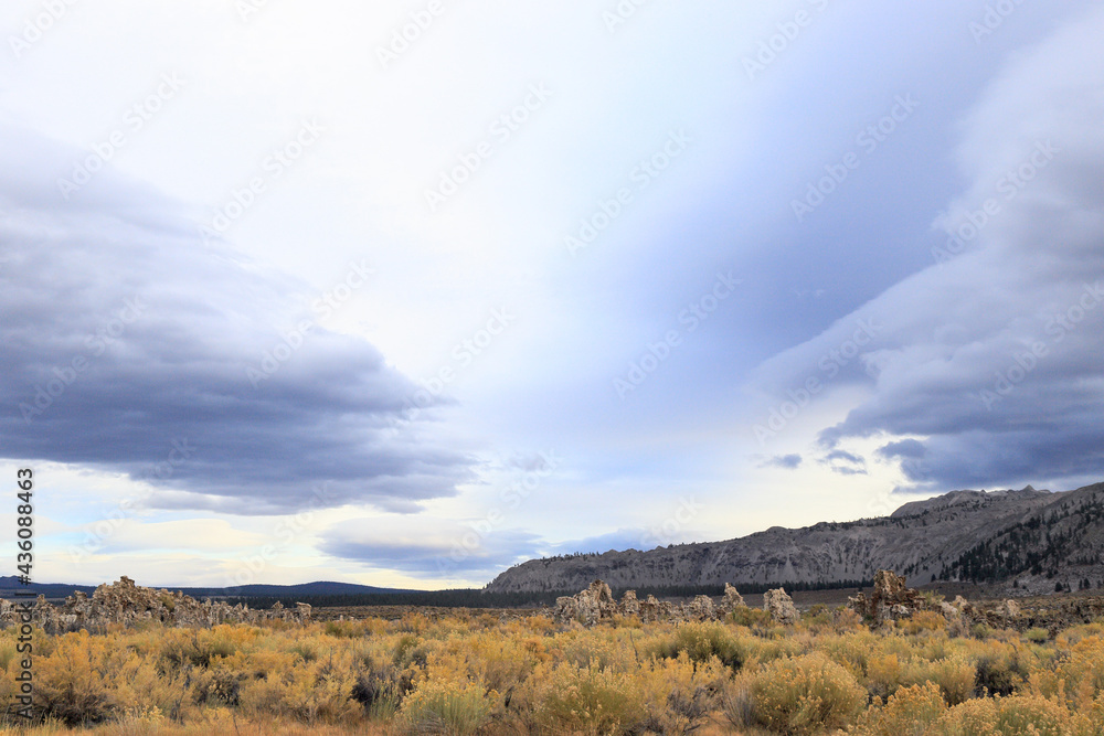 Fantastic colors over Mono Lake with lenticular clouds moving over it at a twilight Fantastic colors over Mono Lake with lenticular clouds moving over it at a twilight