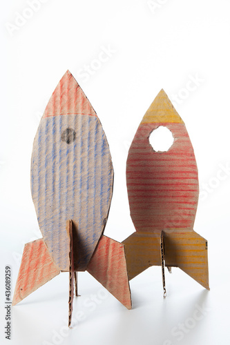Rocket made of cardboard on a white background. Children art project. DIY concept. Cardboard craft.