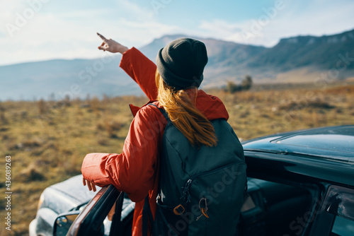 woman near cars gesturing with her hands on nature in the mountains autumn backpack travel tourism © SHOTPRIME STUDIO
