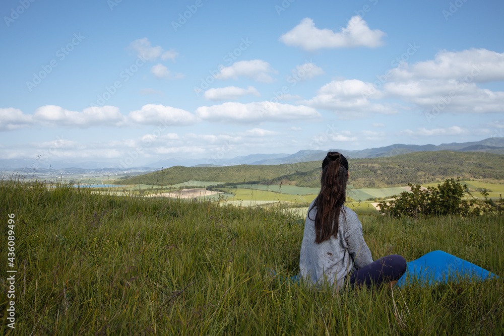 Young woman yoga outdoors keep calm and meditates while practicing yoga Young woman yoga outdoors keep calm and meditates while practicing yoga