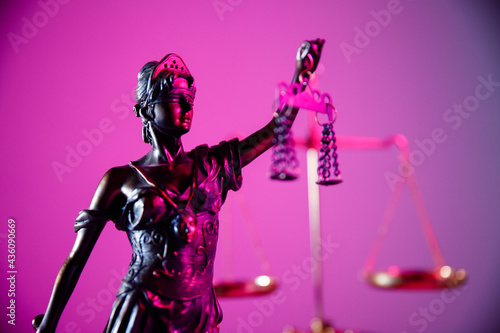 Law and judgment concept. Figure of Lady Justice in purple neon