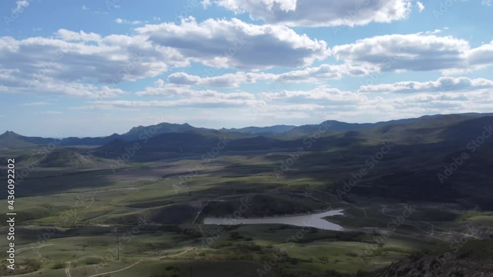 View from above from the drone to the picturesque mountain landscape and the flowing river. Bird's-eye view. High quality 4k footage View from above from the drone to the picturesque mountain landscape and the flowing river. Bird's-eye view. High quality 4k footage