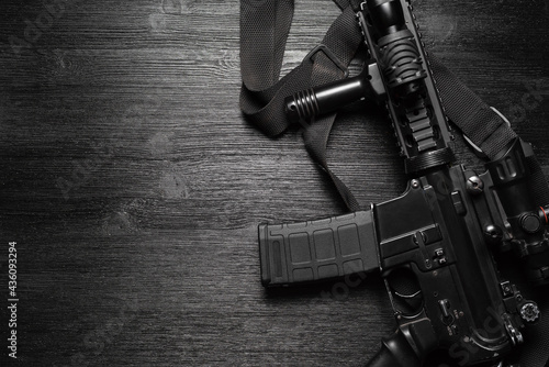 Valokuvatapetti Airsoft rifle on the black flat lay background.