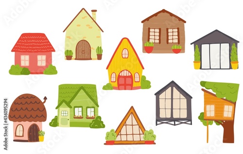 Cartoon children's homes in bright colors. Vector set of houses in pink, green, gray for childrens banners, cards, labels.