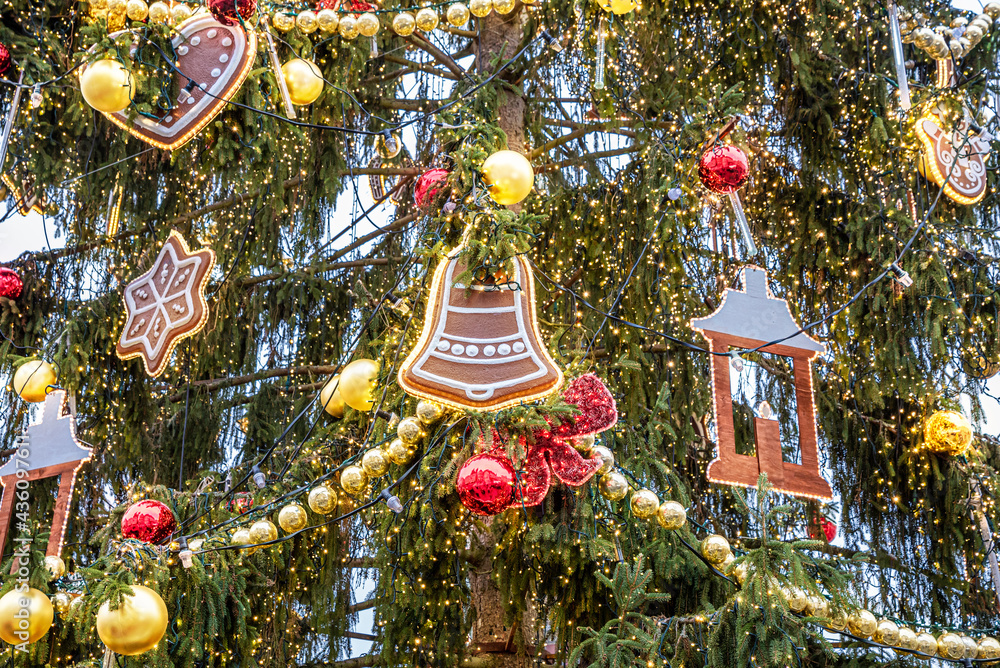 Fototapeta premium Close-up view of a Christmas tree and decorations on the branches outdoors in Prague in winter holiday season