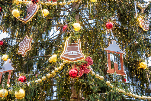 Photography Close-up view of a Christmas tree and decorations on the branches outdoors in Pr