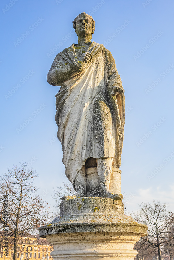 Two rings of statues at small canal in Padua Prato della Valle (Pra deła Vale) - largest square in Italy with a green island at center. Padova (Padua), Veneto, Italy.