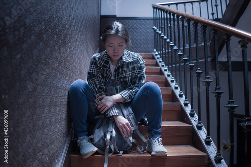 young beautiful Asian woman in pain suffering depression - drama