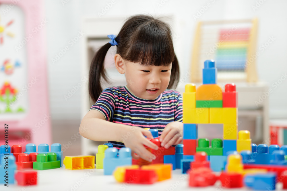 young girl playing creative toy blocks for homeschooling young girl playing creative toy blocks for homeschooling