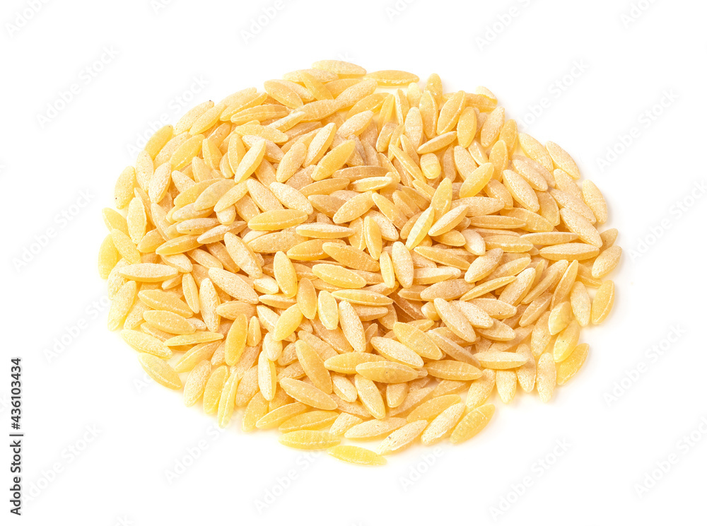 pile of uncooked risoni pastina closeup on white pile of uncooked risoni pastina closeup on white