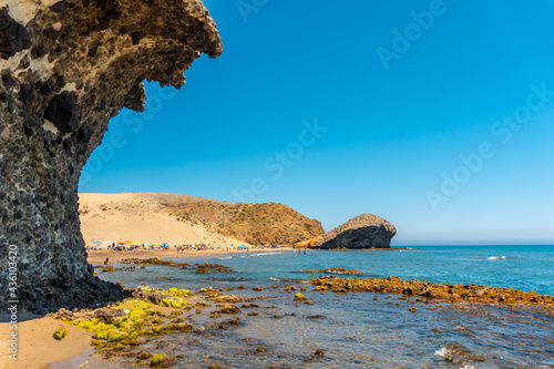 Summer at Monsul Beach in the Cabo de Gata Natural Park, created with eroded lava formations in the municipality of San Jose, Almeria. Spain