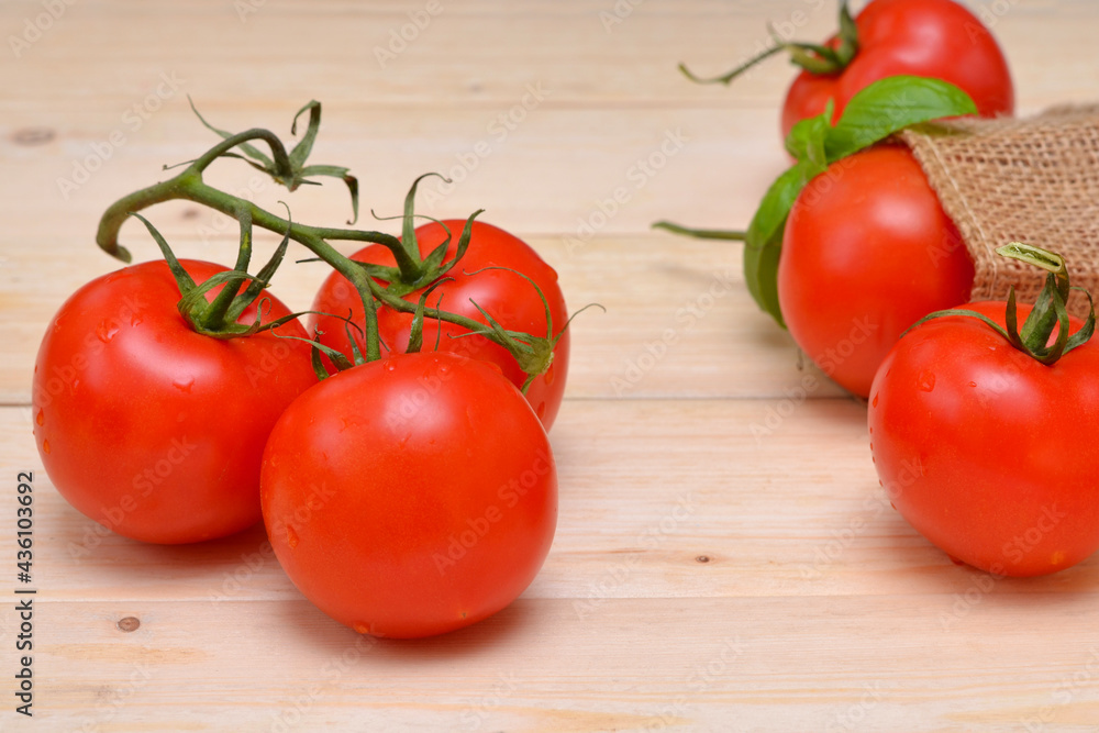 fresh tomatoes on a branch close-up on the table fresh tomatoes on a branch close-up on the table