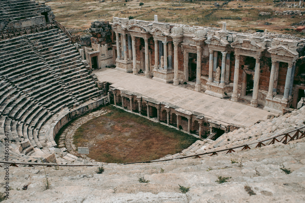 Ancient Roman amphitheater made of stone under the open sky in Pamukkale in Turkey