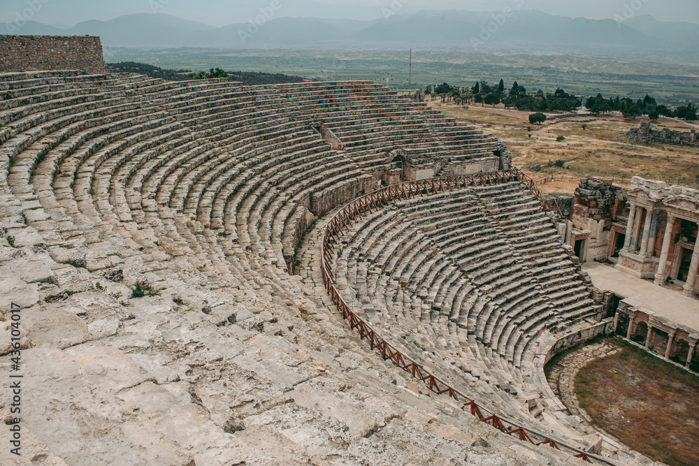 Ancient Roman amphitheater made of stone under the open sky in Pamukkale in Turkey