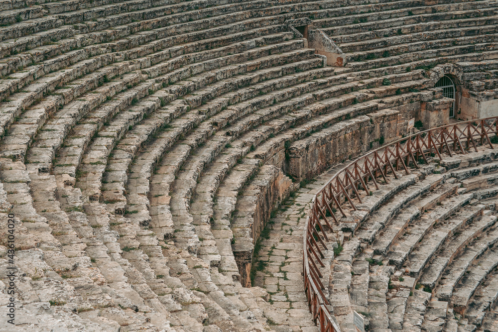 Ancient Roman amphitheater made of stone under the open sky in Pamukkale in Turkey